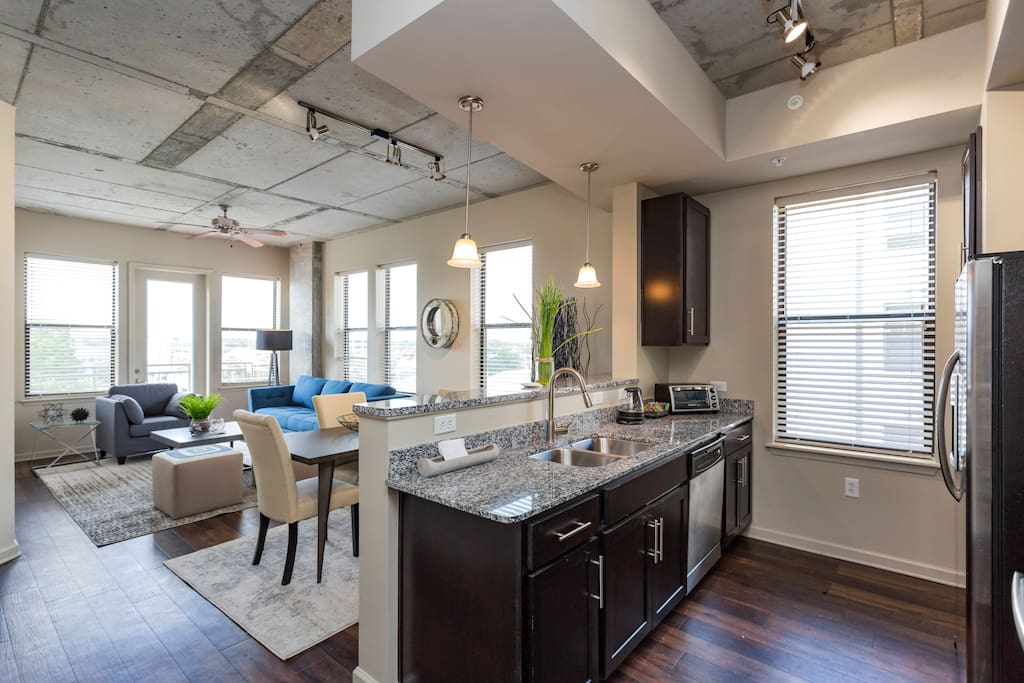 Fully equipped kitchen with ample cooking space and full size dishwasher