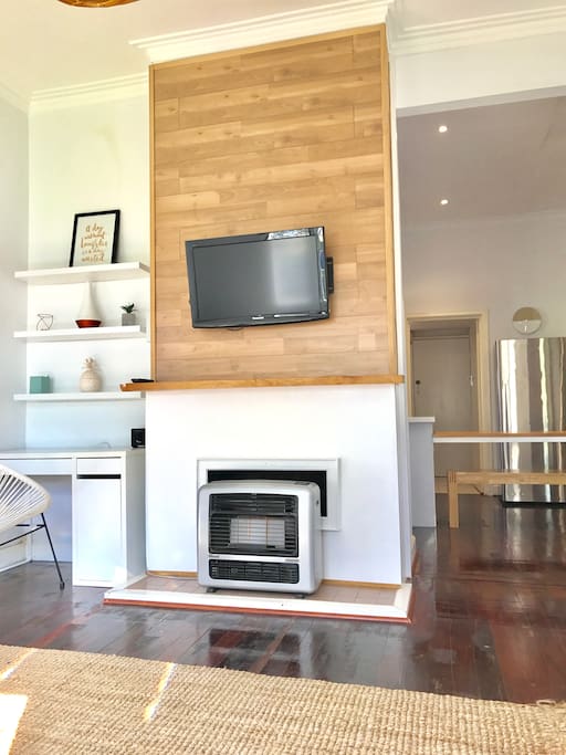 Lounge room with tv and gas heater