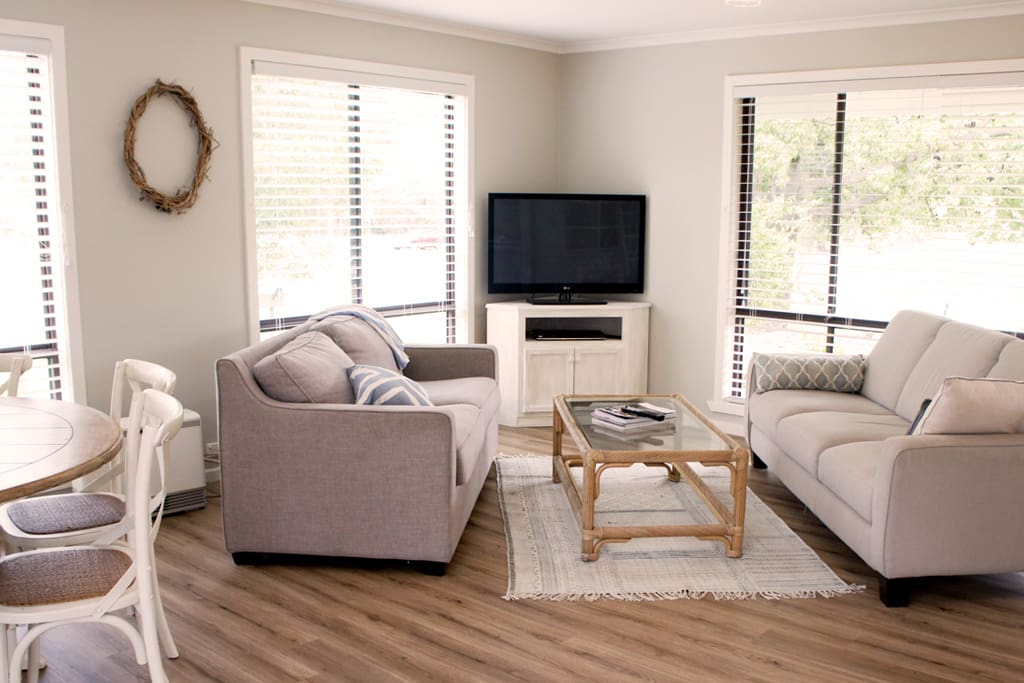 Lounge area including sofa bed, comfortable 3 seater couch and flat screen TV including DVD player