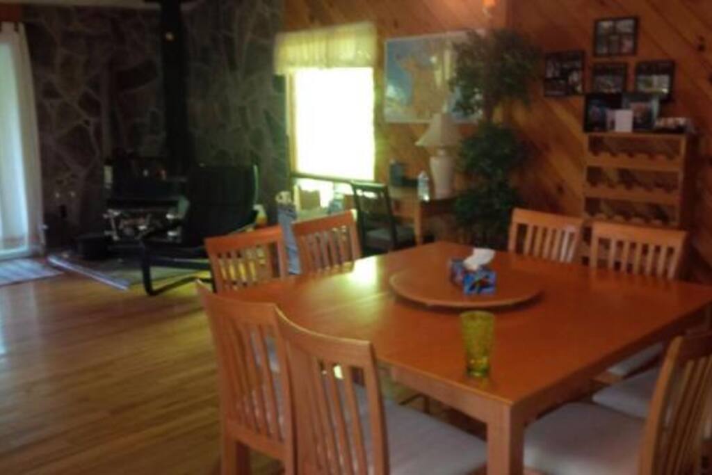 Dining room open concept to fireplace.
