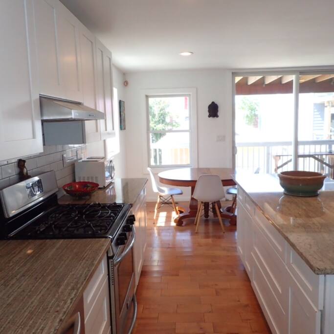 KITCHEN-custom built kitchen, new stainless steel appliances, dishwasher, stove, fridge, microwave.