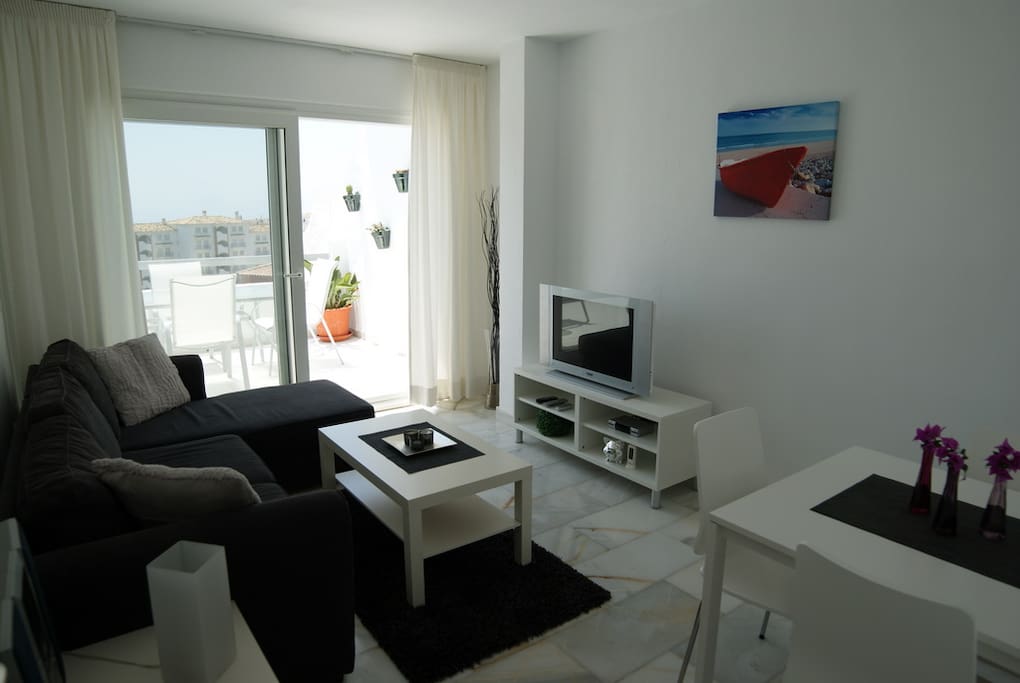 Lounge with dining area and sofa-bed