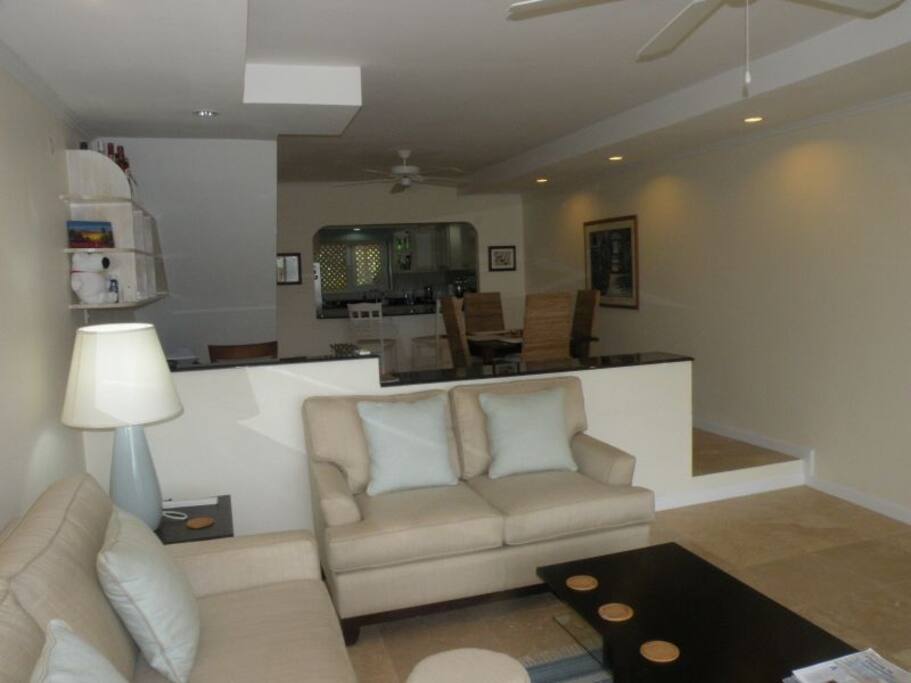Living room features air conditioning and full door mosquito screen