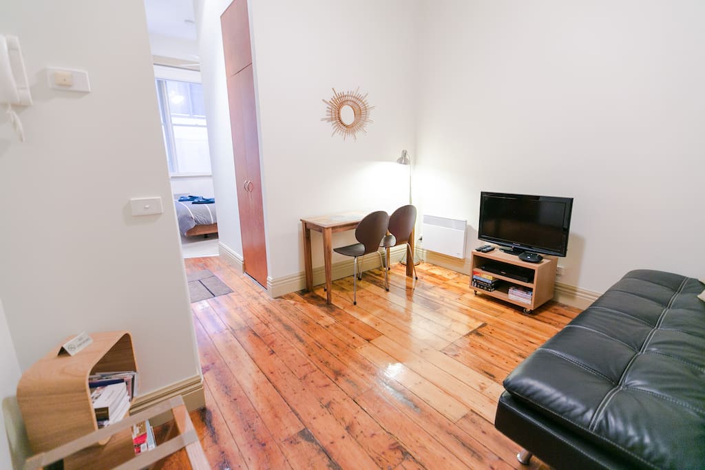 Lounge room with TV, DVD's and iPhone charger