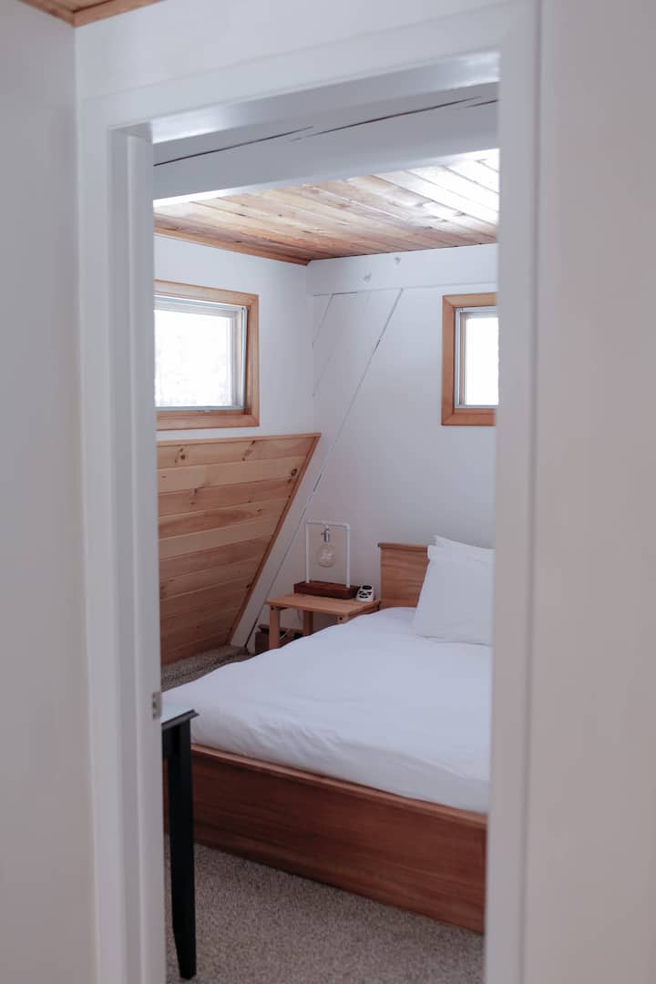 Downstairs bedroom with full bed