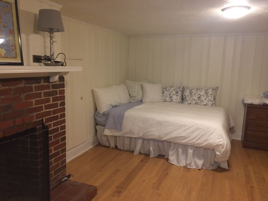 cozy bed tucked into the corner makes for the perfect crash pad