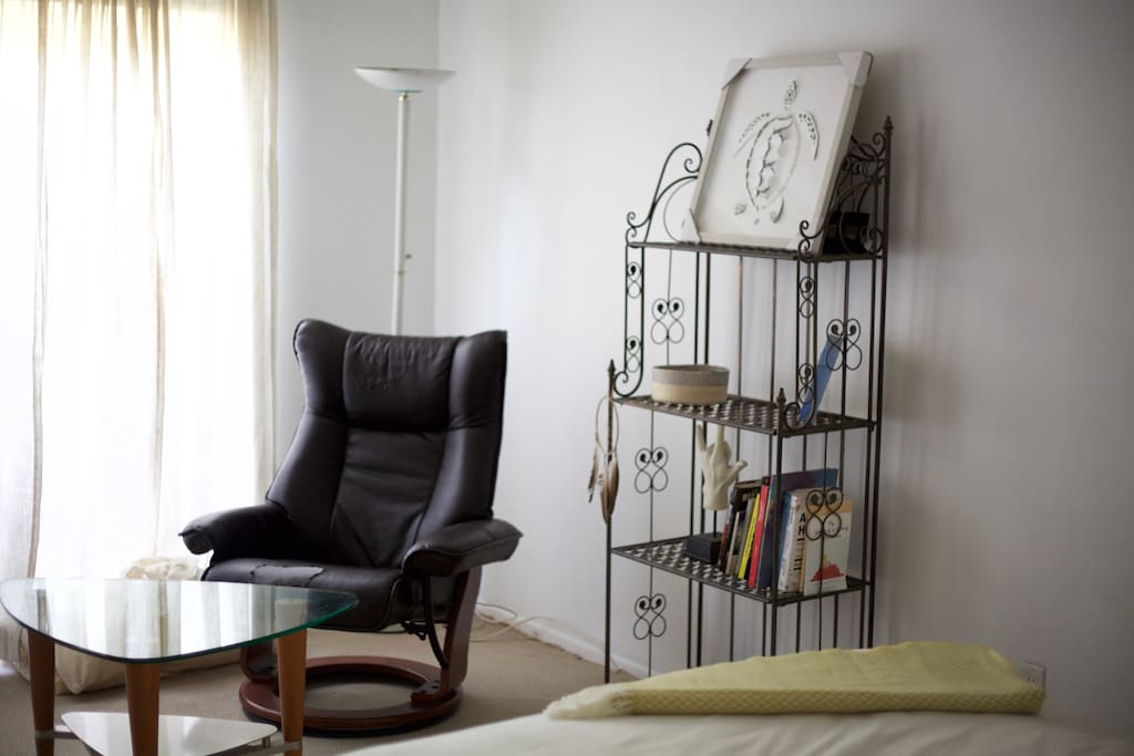 Theres a small reading area in the room.