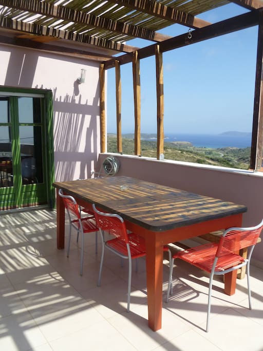 Shaded dining area with sea views