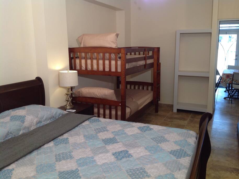 Bedroom queen bed and a twin/twin bunk bed.