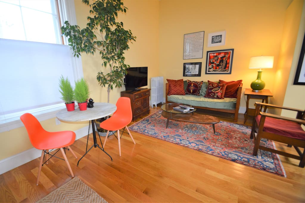 The living room features smart TV that has local stations and is Netflix ready.