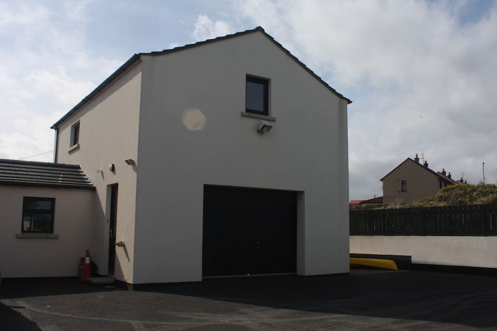 The apartment is above our garage to the rear of the house