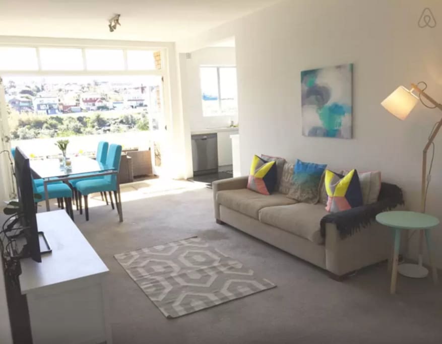 Bright and modern lounge room, perfect for relaxing after a hard day at the beach.