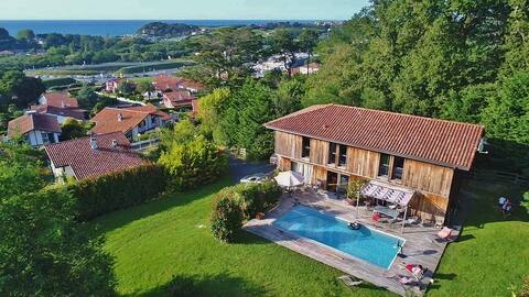 Charming wooden villa with sea view and heated pool