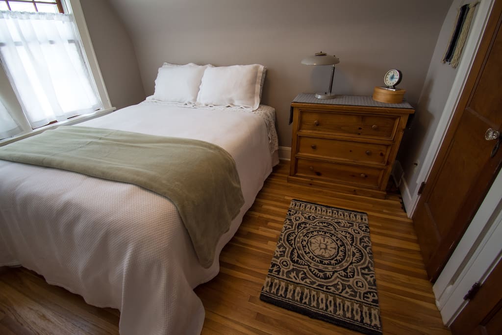 Bedroom features Queen size bed as spacious closet & dresser.