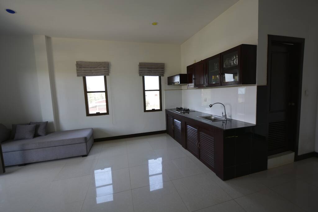 Living room with equipped kitchen