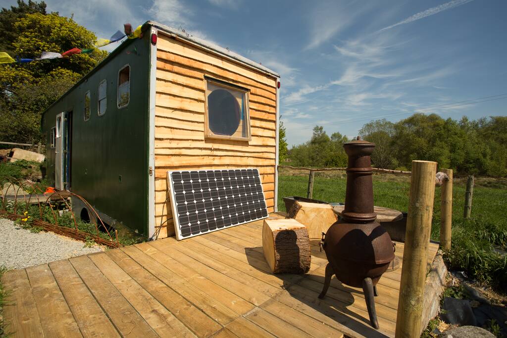The truck has its own deck area with wood stove