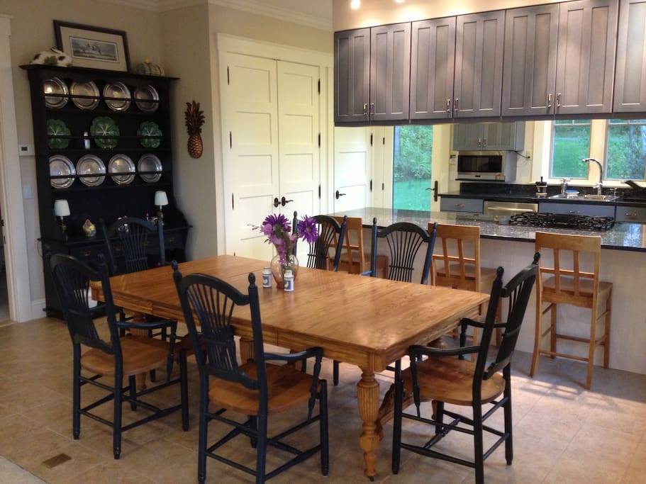 Dining Area seats 6-8 at table. Counter with 3 stools for quick meals