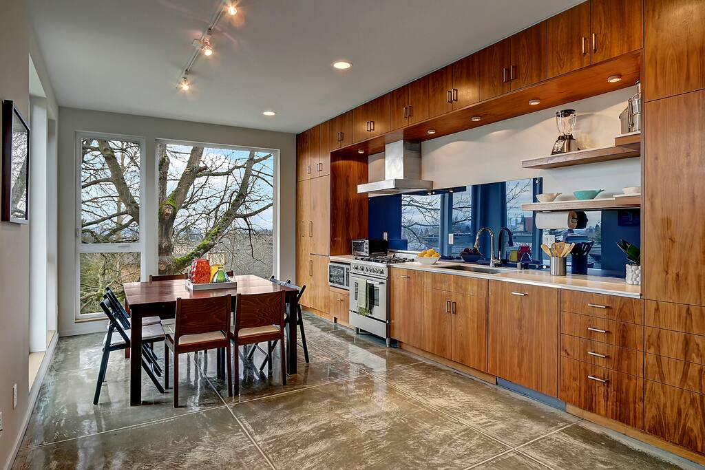 The 3rd floor kitchen is spacious and equipped, ready for your group dinner.