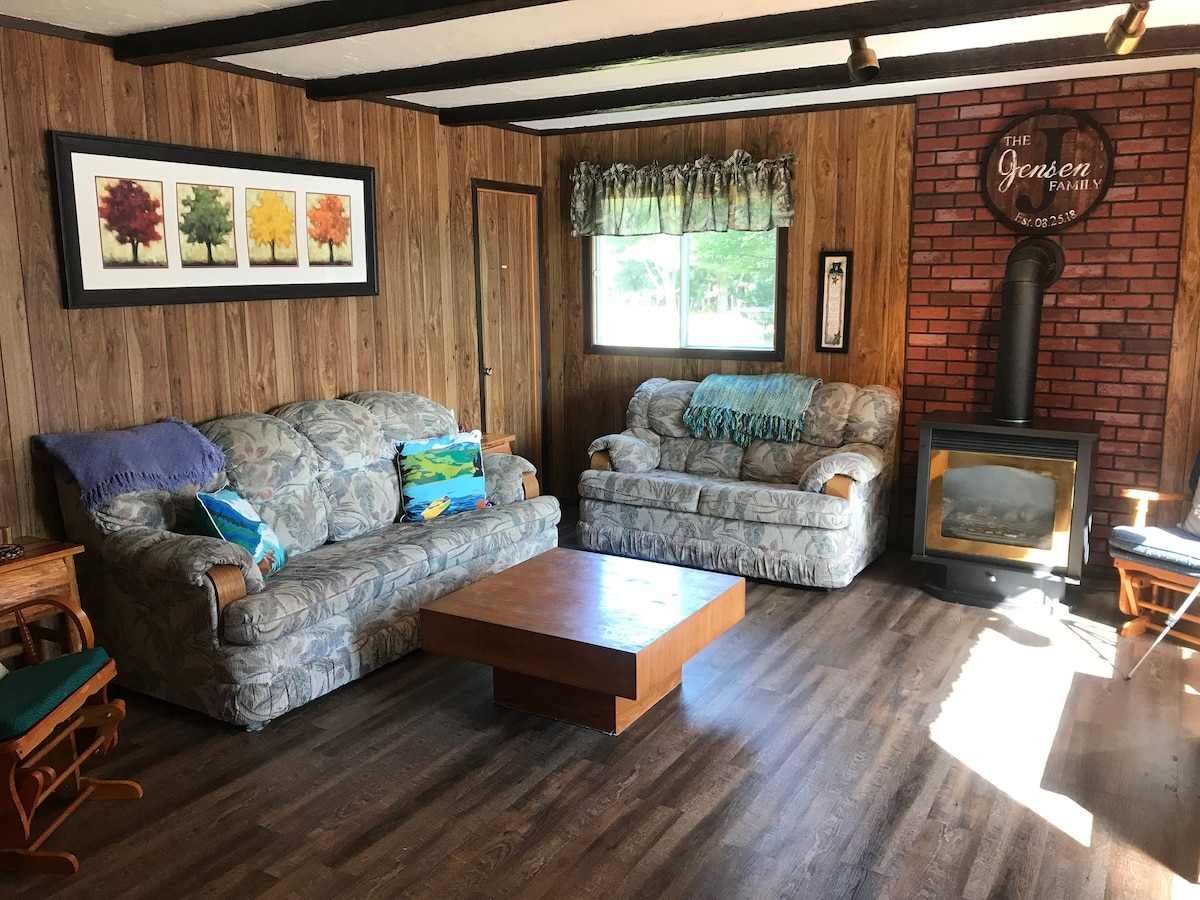 Large living space with television for DVD’s, Bluetooth speakers, cozy propane fireplace, large view of the lake