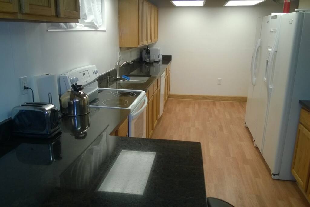 Granite countertops, stove, fridges, dishwasher, cooking & eating supplies, Large Kitchen - 10' x 20'