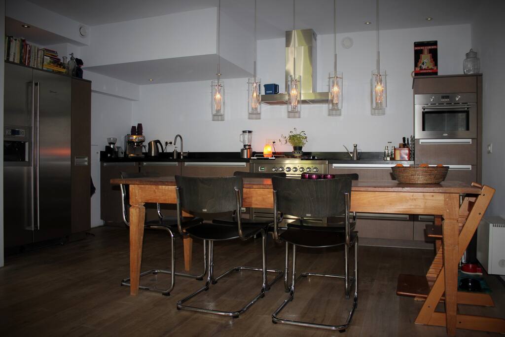 Modern open kitchen with large dining table