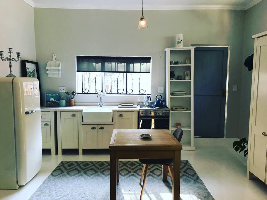 A fully equipped kitchen for guests who love to cook. The window looks back out onto the parking area.
