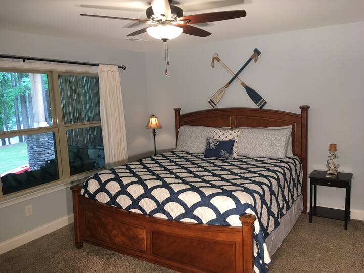 Huge master suite with spectacular views of the lake. It has an attached bathroom, king-sized bed, full-size couch, walk-in closet, & flat screen tv w/dvd player.