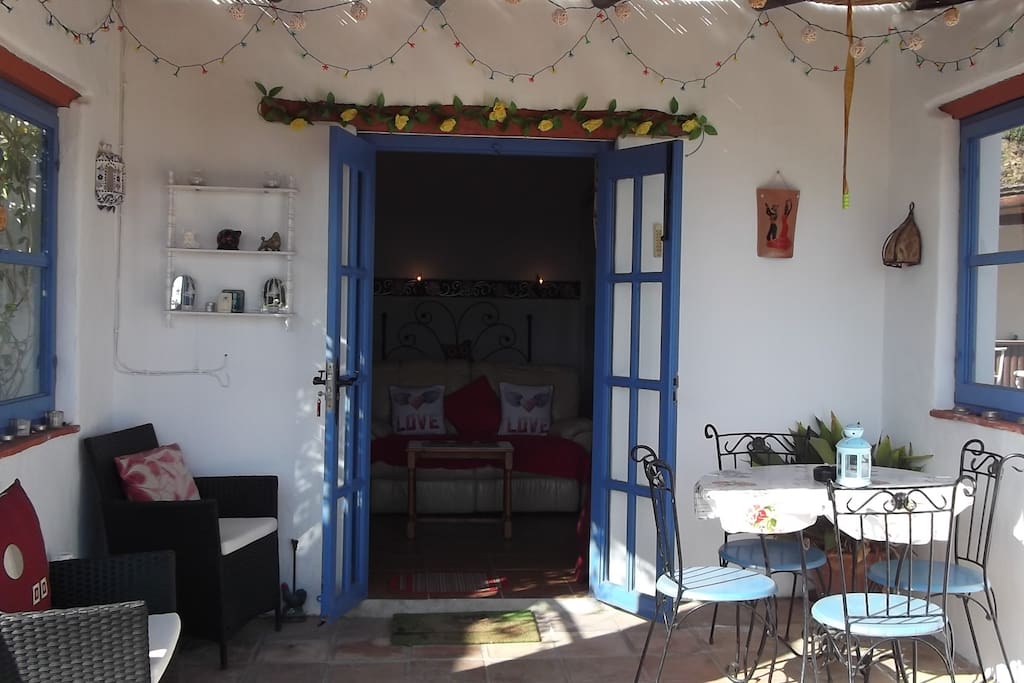 Shaded Dining and Relaxing Porch. French doors leading into the apartment.