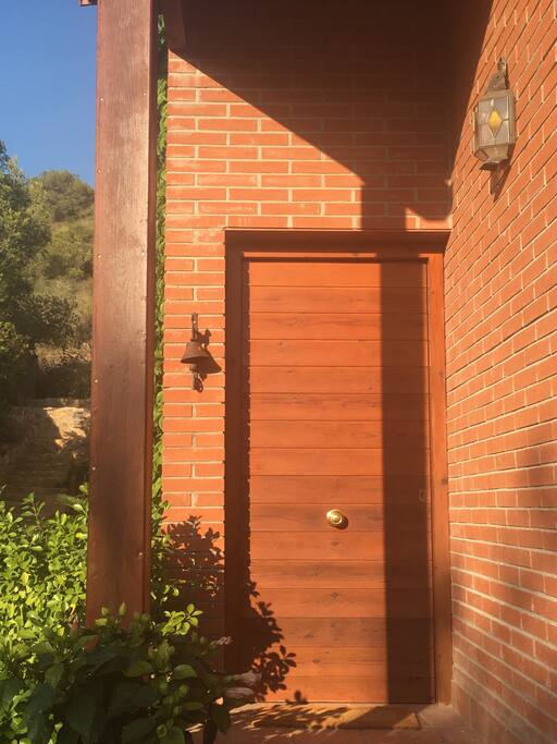 There are two doors: This is the front door. The other on is at the back near the back patio