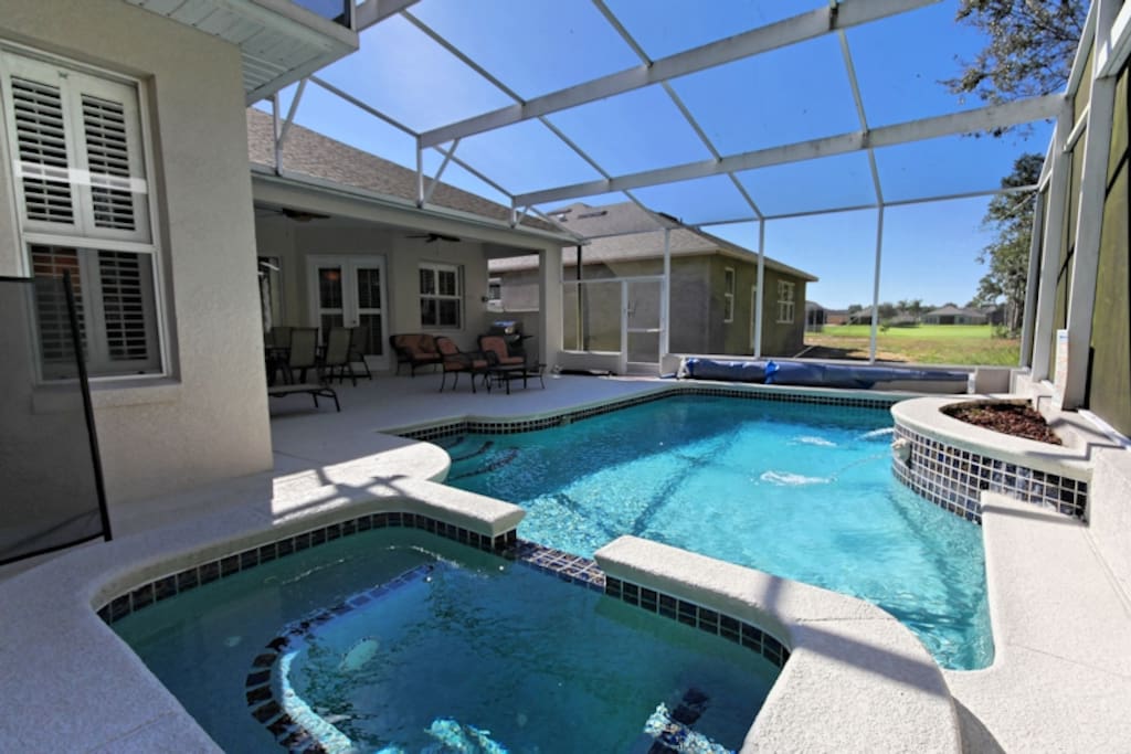 The property backs onto a green space offering privacy in the pool and patio areas. The pool can be heated and is enclosed with a screened lanai with a covered patio area for dining or to retreat from the sun. There is also an extended lanai section for those who want to soak up extra sun!