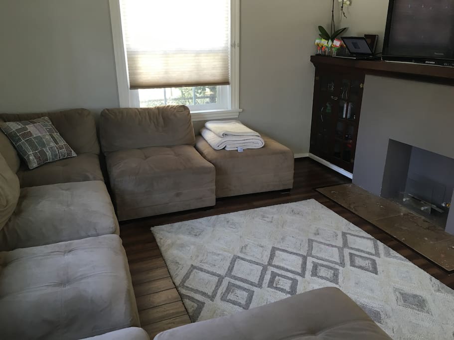living room with 47" flatscreen over gas fireplace