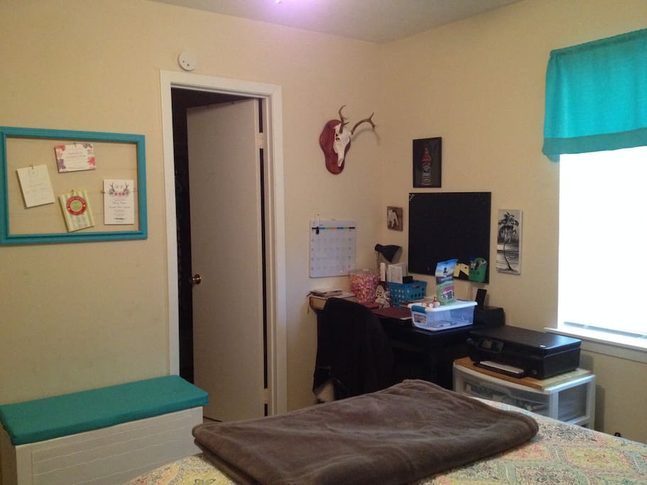 Guest bedroom from another view. The door leads to the private bathroom. We will not use the office space during your stay to respect your privacy.