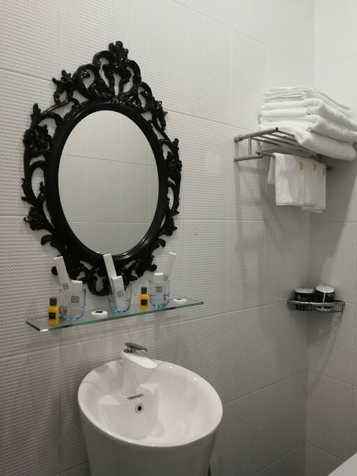 One single bed & one King size bed bathroom