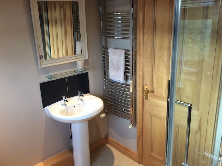 Very warm bathroom with heated towel rail and underfloor heating