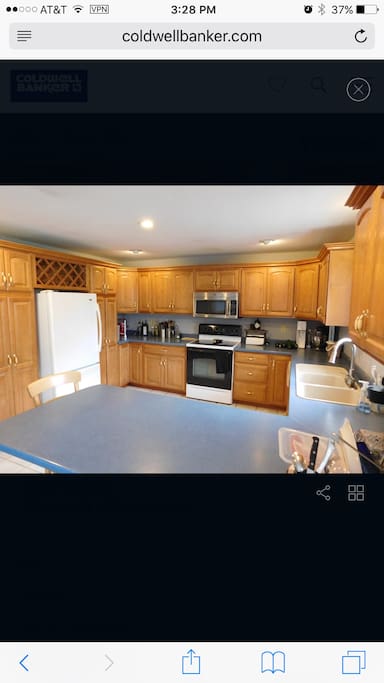 A large kitchen, with a breakfast bar, for friends and family to gather, cook and enjoy good times together.