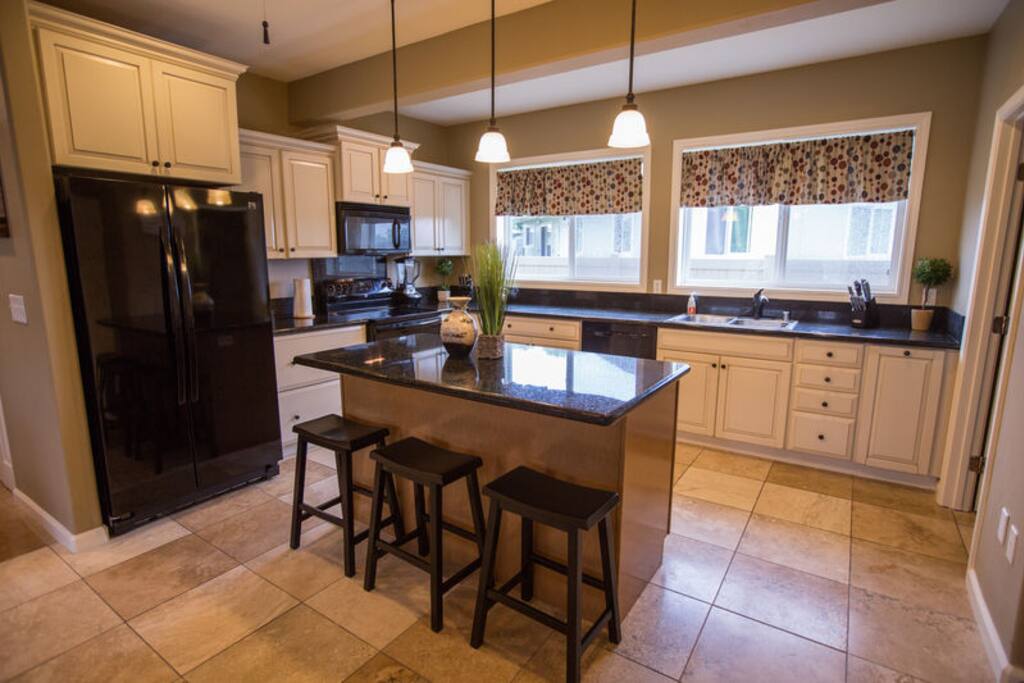 Our home features 2 full kitchens-perfect for larger groups! This kitchen is located downstairs and has 2 refrigerators.