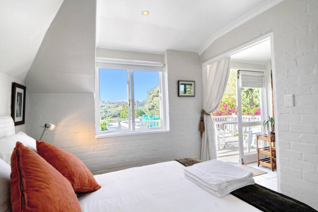 Bedroom leading into open plan kitchen
