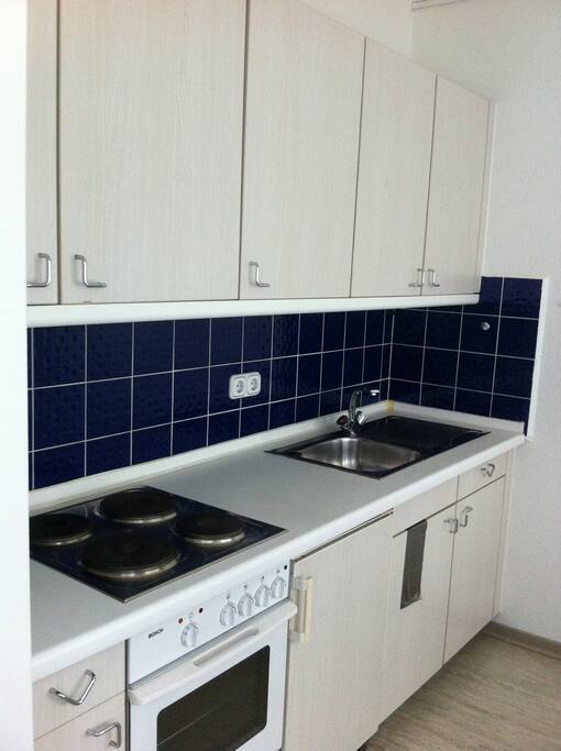 furnished and fully equipped kitchen with heating