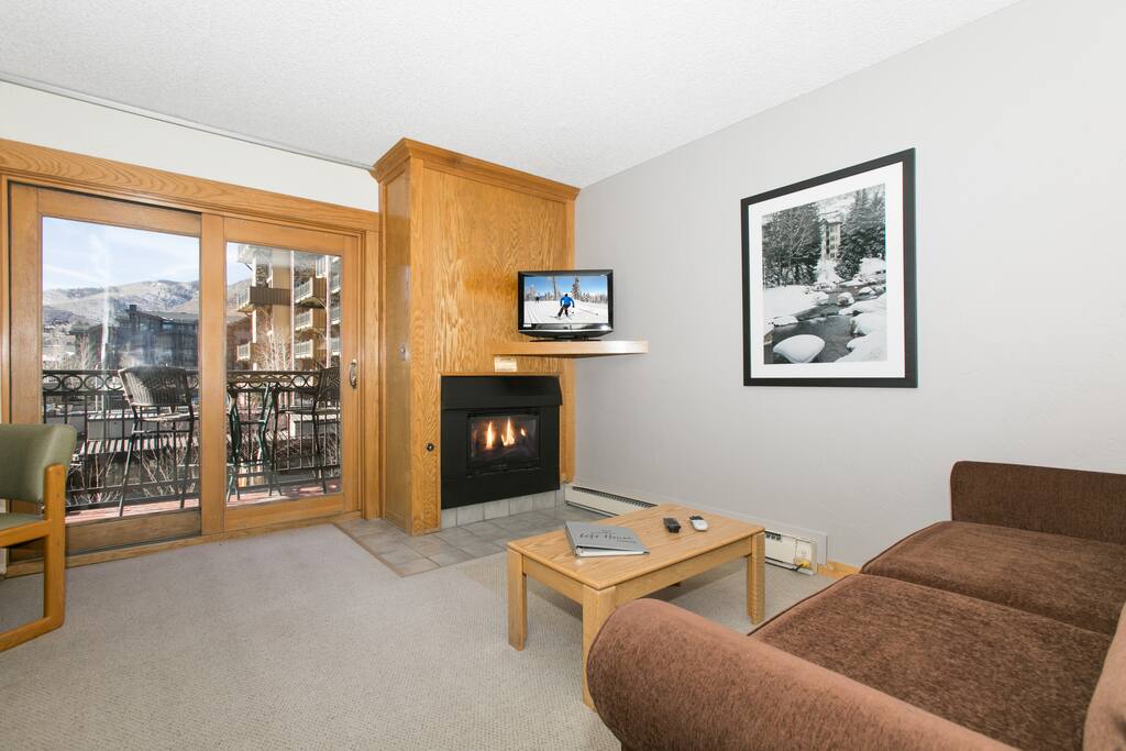 Living area with 32-inch TV and gas fireplace