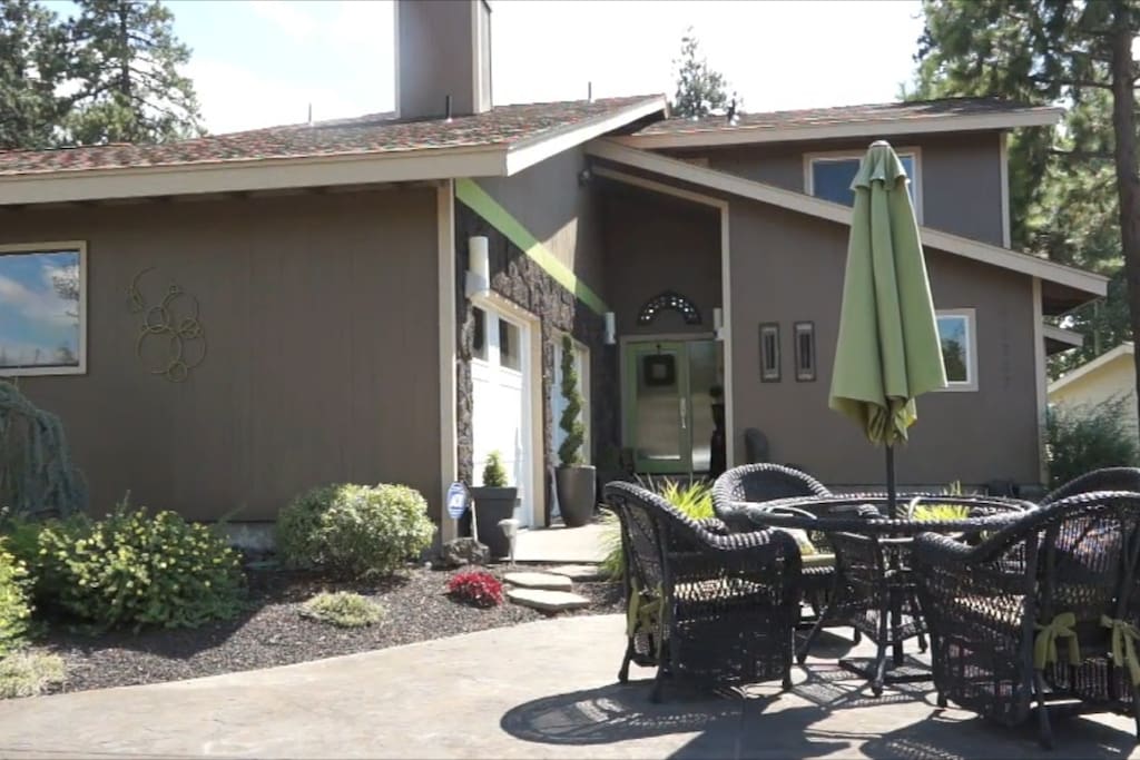 This area boast a swim spa pool and hot tub with a covered pergola with many lounge areas.