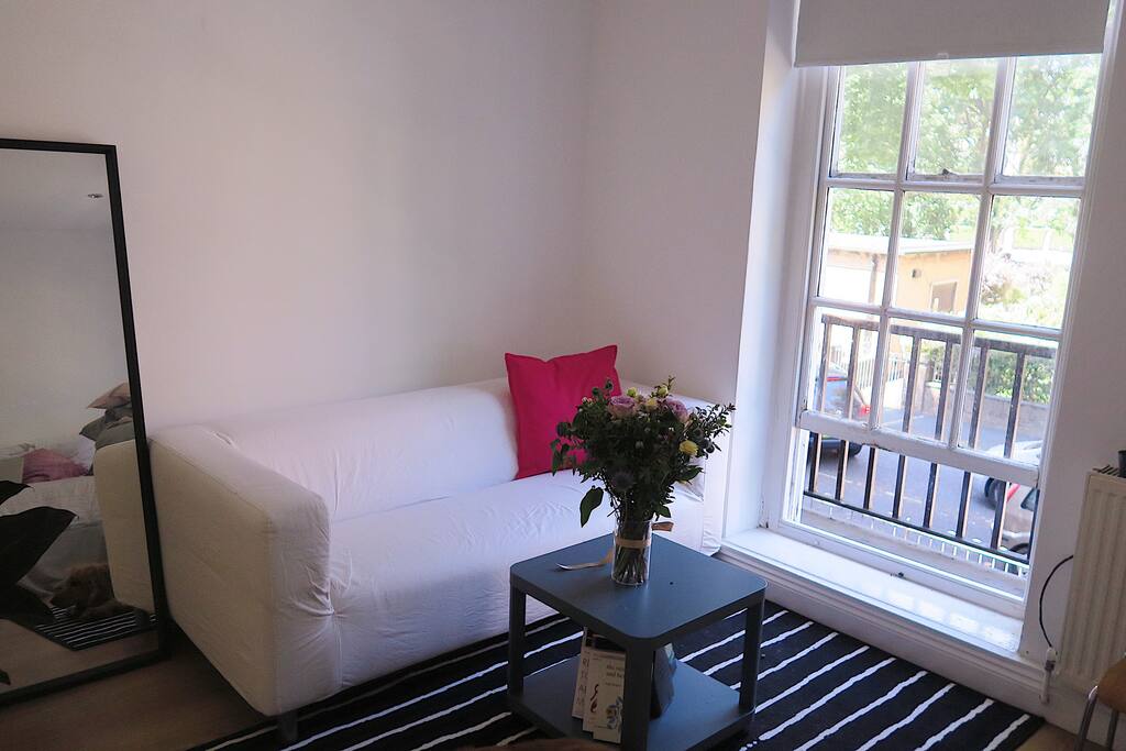 other big window - sofa and big mirror