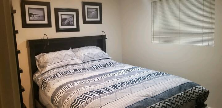 Master bedroom with new queen bed and cozy down duvet.