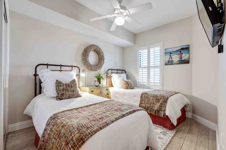 Twin bedroom with 2 twins and a thick foam mattress for an extra sleeper.