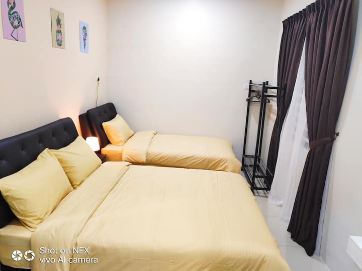 1st floor (room2) provided 1-queen size & 1-super single size beds, cloth hanging Table and privacy bathroom 