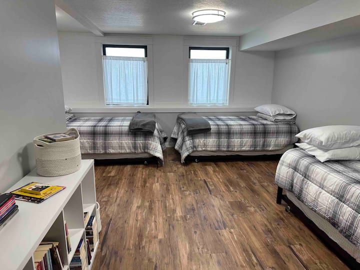 "Bunk room" with 3 twin beds and 3 trundle beds