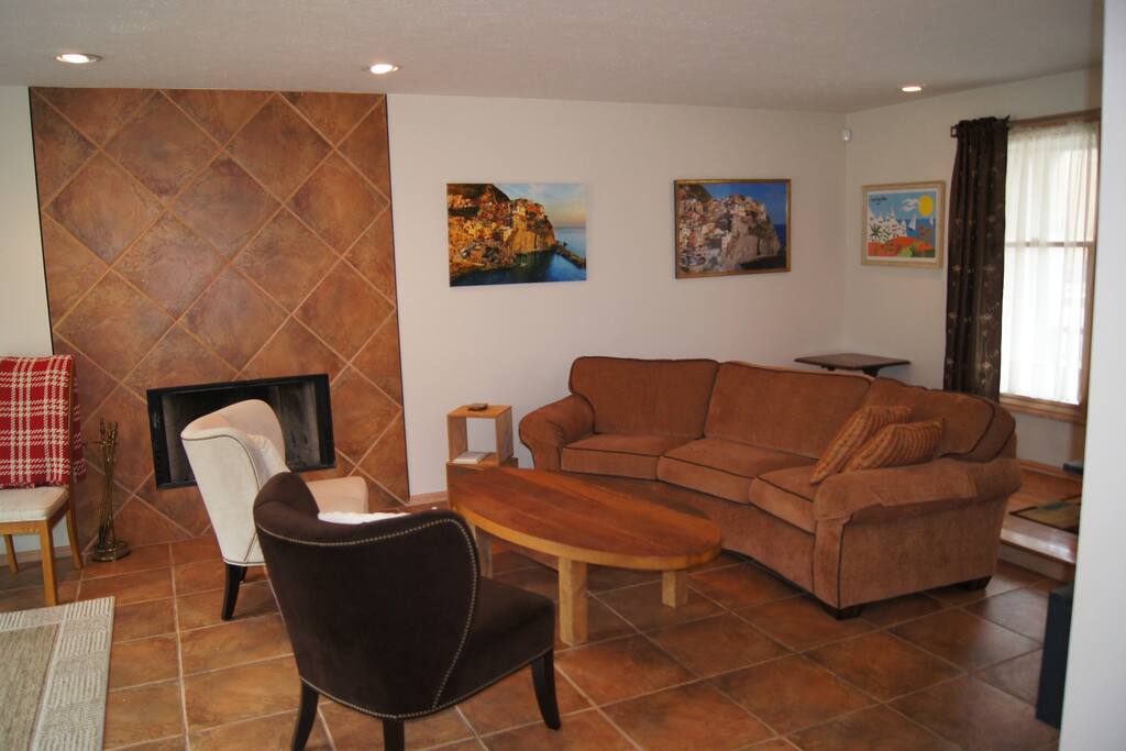 Extra large living room with natural light and walk-out to private deck