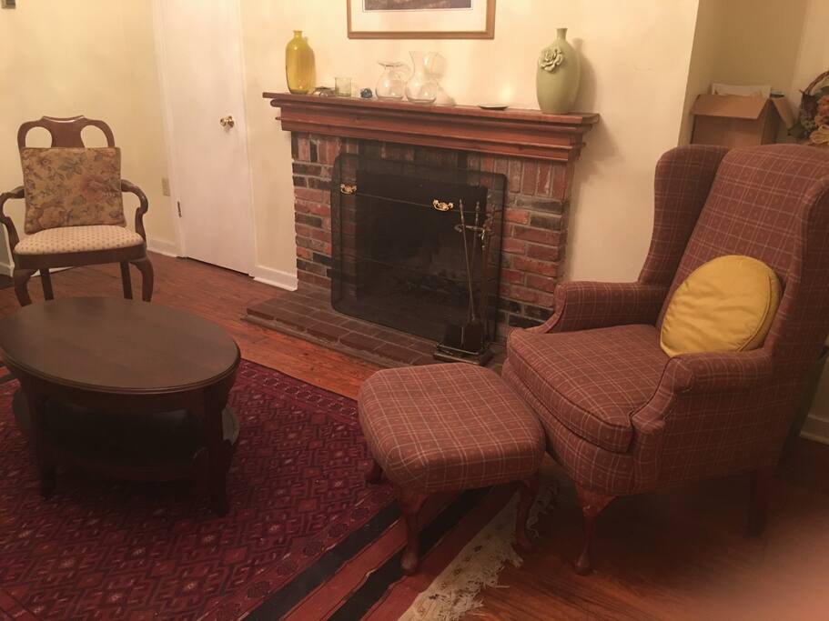Cozy shared living room with working fireplace in historic property