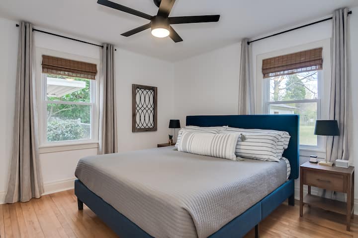 Bedroom with king bed and blackout curtains