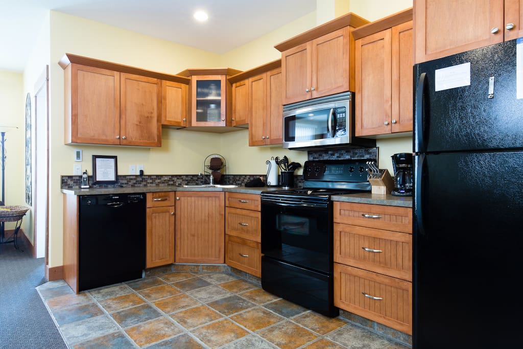 The kitchen has heated tile floors and fully stocked.