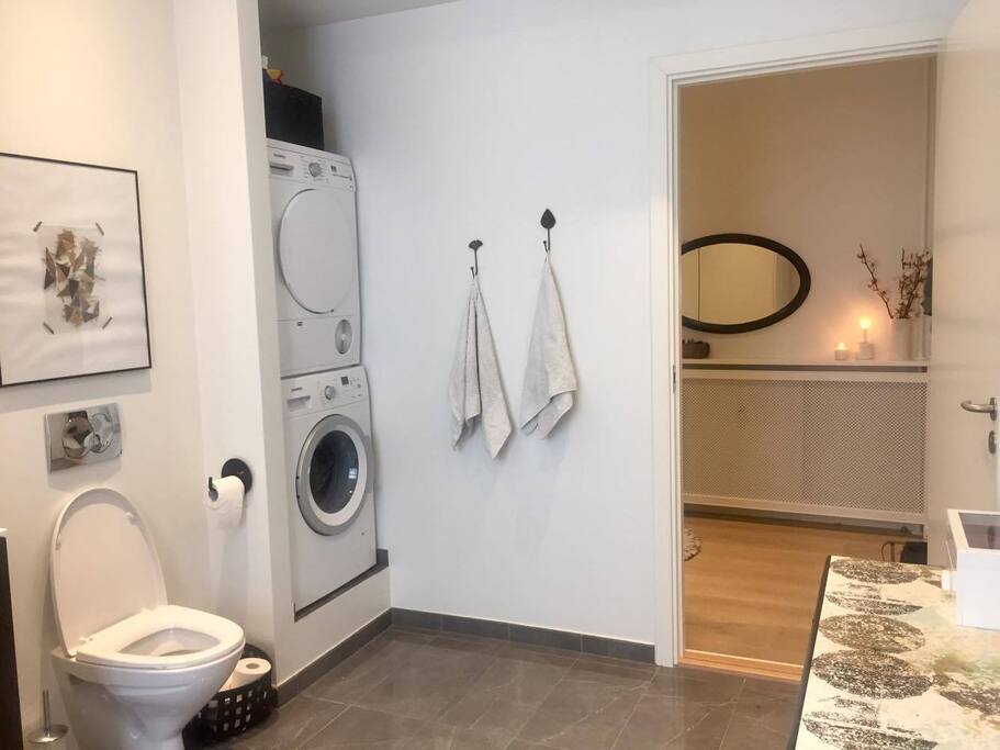 The big and luxurious bathroom with floor-heating.